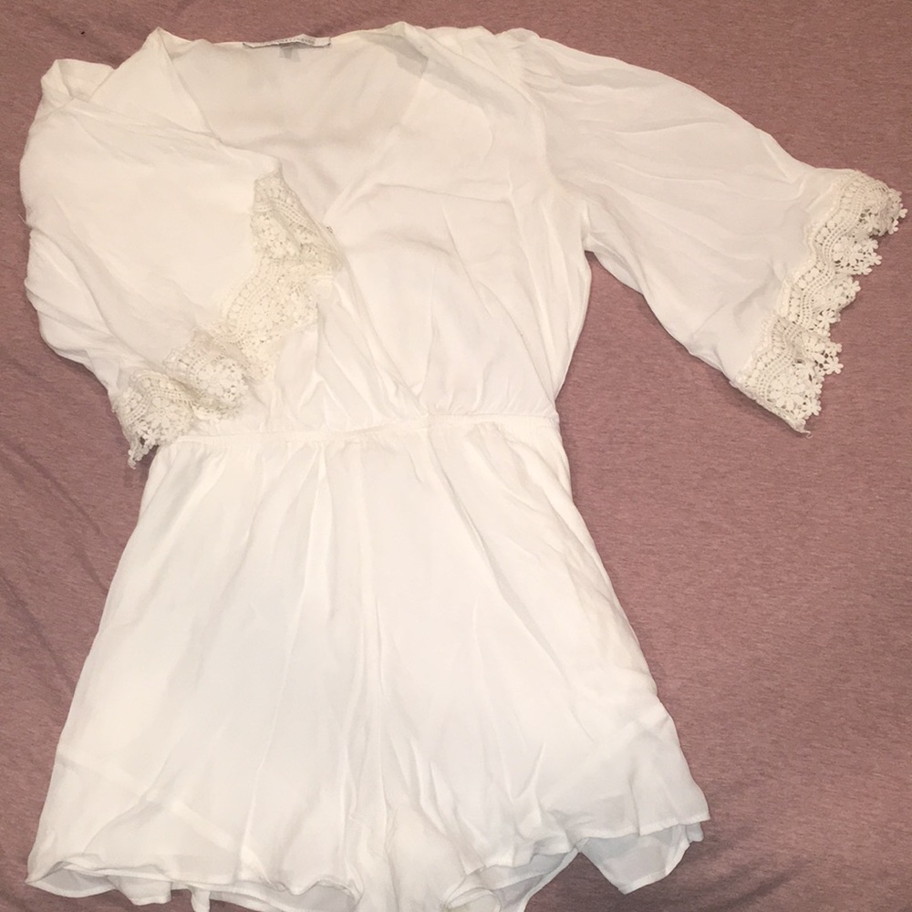 Beautiful white romper. Never worn.